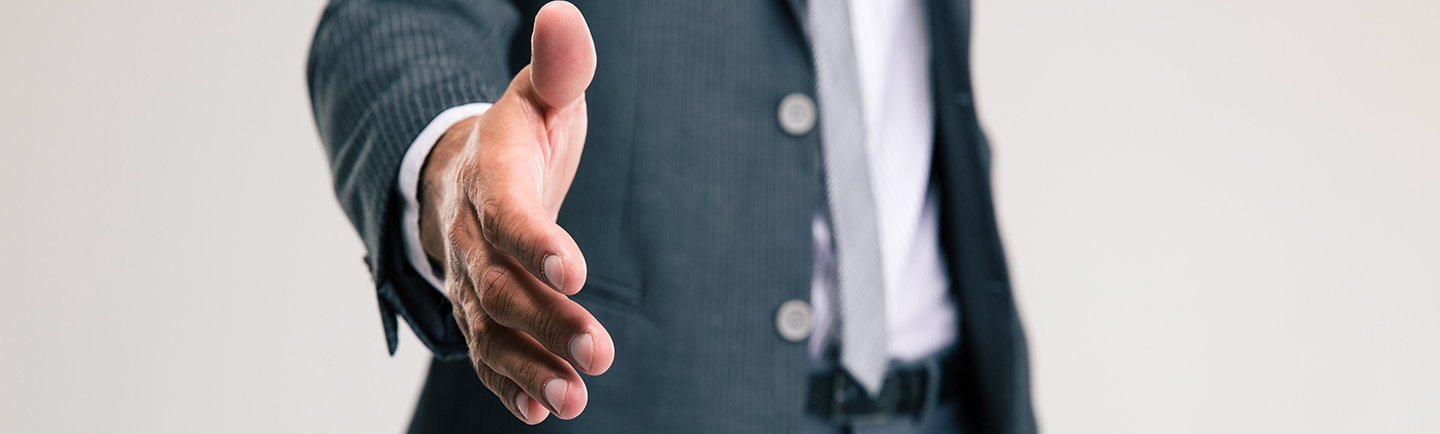 man with outstretch hand to shake