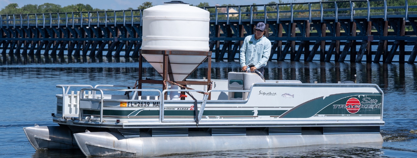 man standing on boat