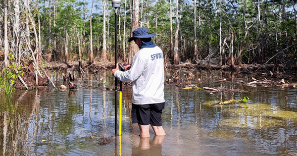 employee protecting water resources