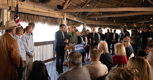 governor desantis standing before large crowd