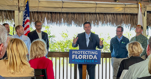 governor desantis standing at podium