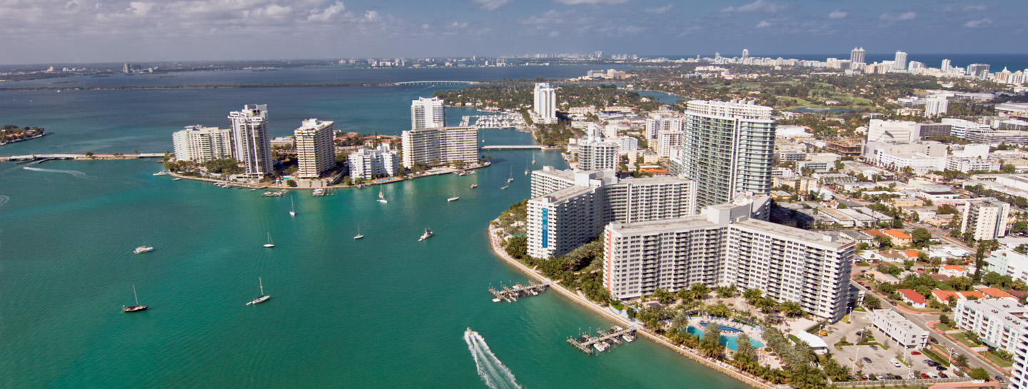 Aerial view of a coastal bay with high-rise buildings