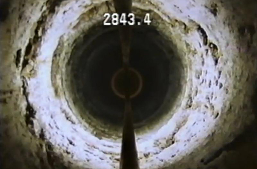 screenshot of video from inside a deep injection well