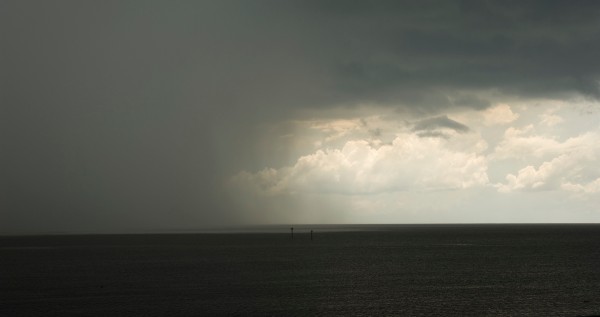 rain moving over water