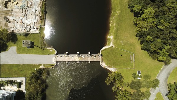 birds eye view of flood control structure on a canal