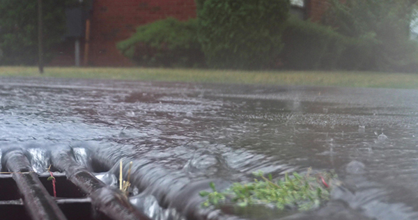 water funneling into storm drain