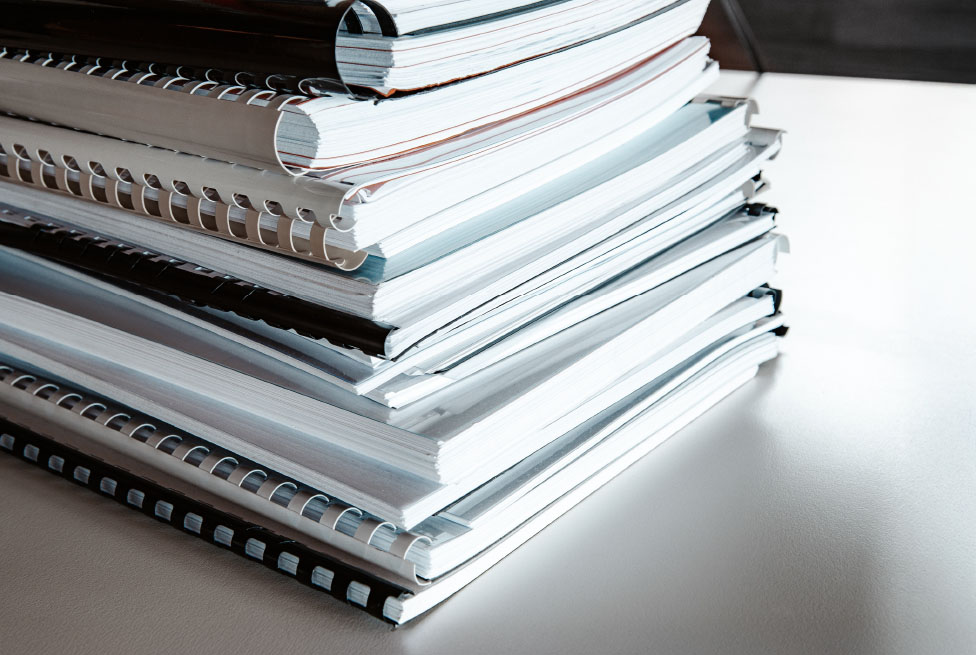 Stack of reports on a desk